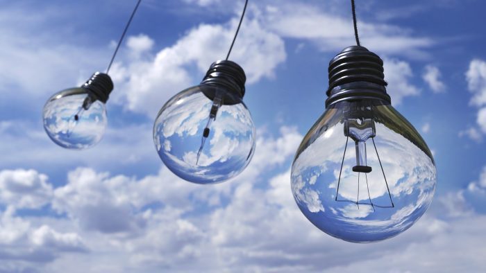 three lightbulbs against a cloudy sky make your brand more sustainable